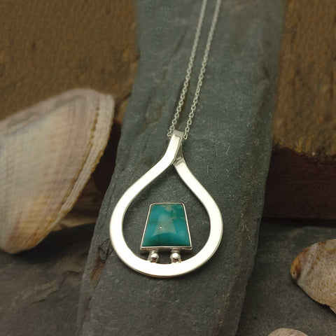 Turquoise stone set in a sterling silver teardrop pendant