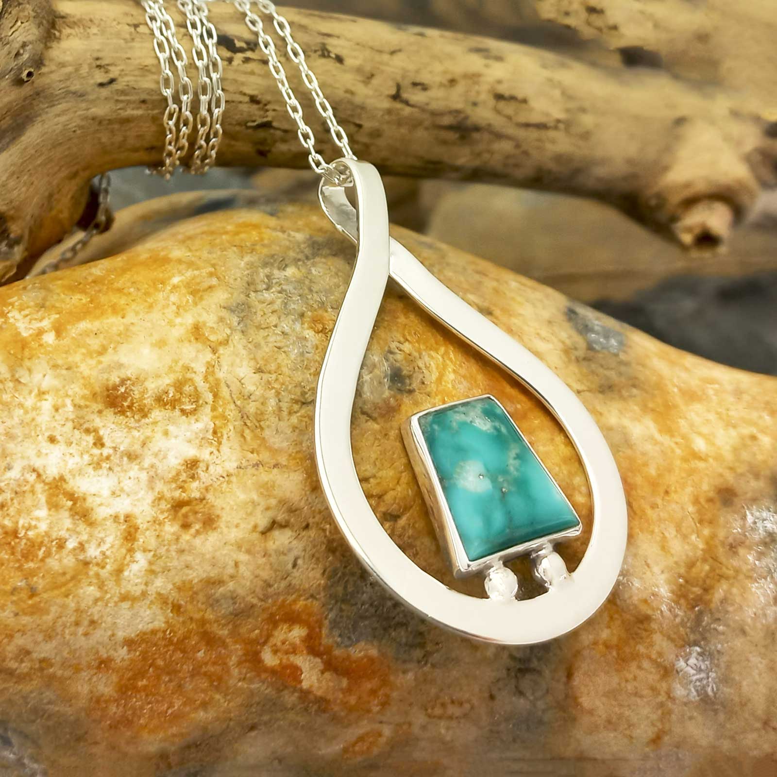 Silver teardrop with rectangular turquoise stone pendant