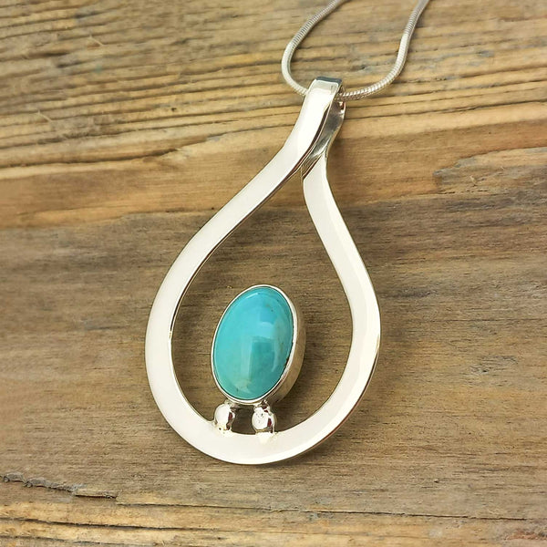 Handcrafted Mexican silver pendant with turquoise stone