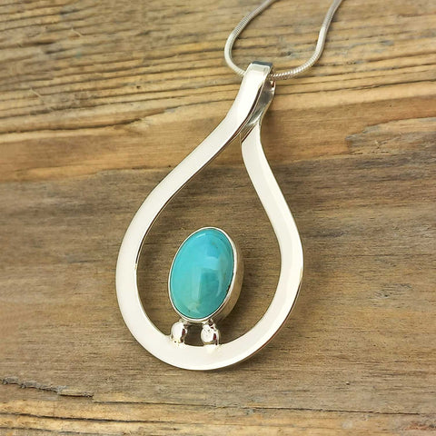 Handcrafted Mexican silver pendant with turquoise stone