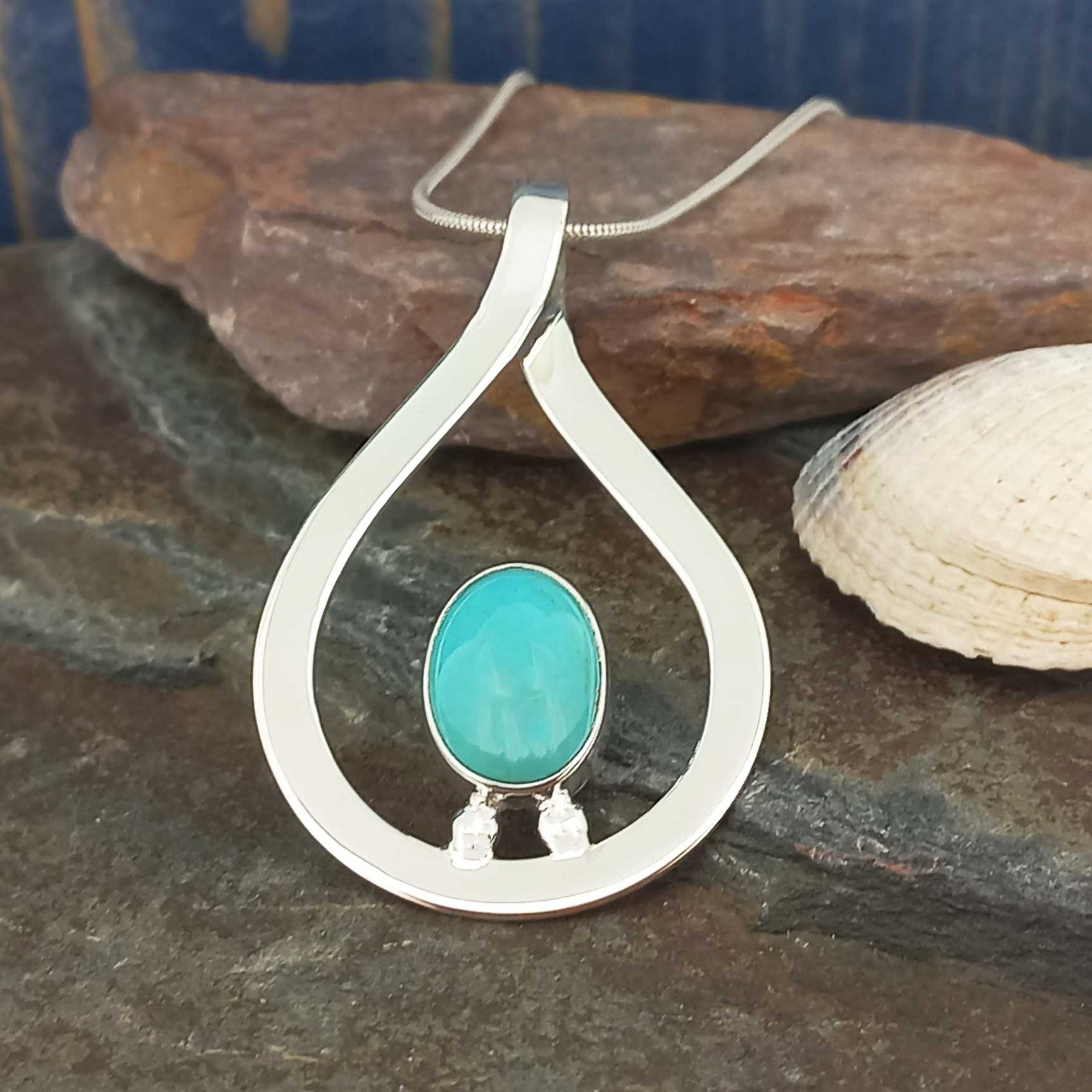 Handmade silver teardrop pendant with an oval Turquoise stone