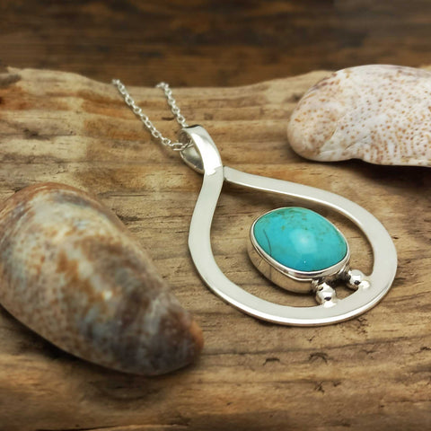 Unusual silver teardrop pendant with Turquoise