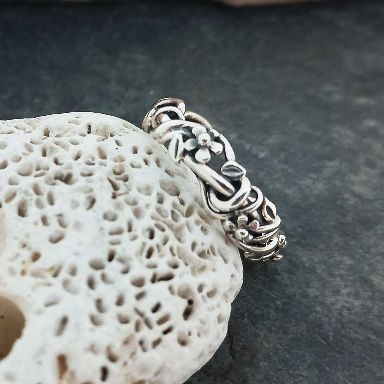 Silver band with flowers ring