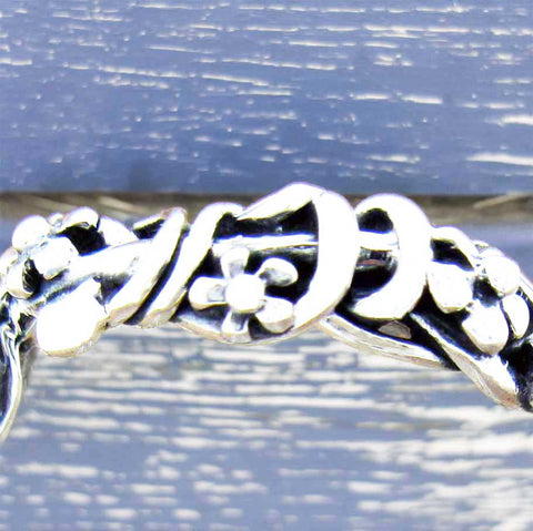 Silver band with flowers ring