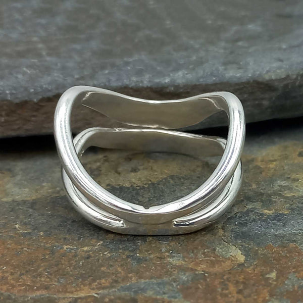 Back of silver ring on a stone surface