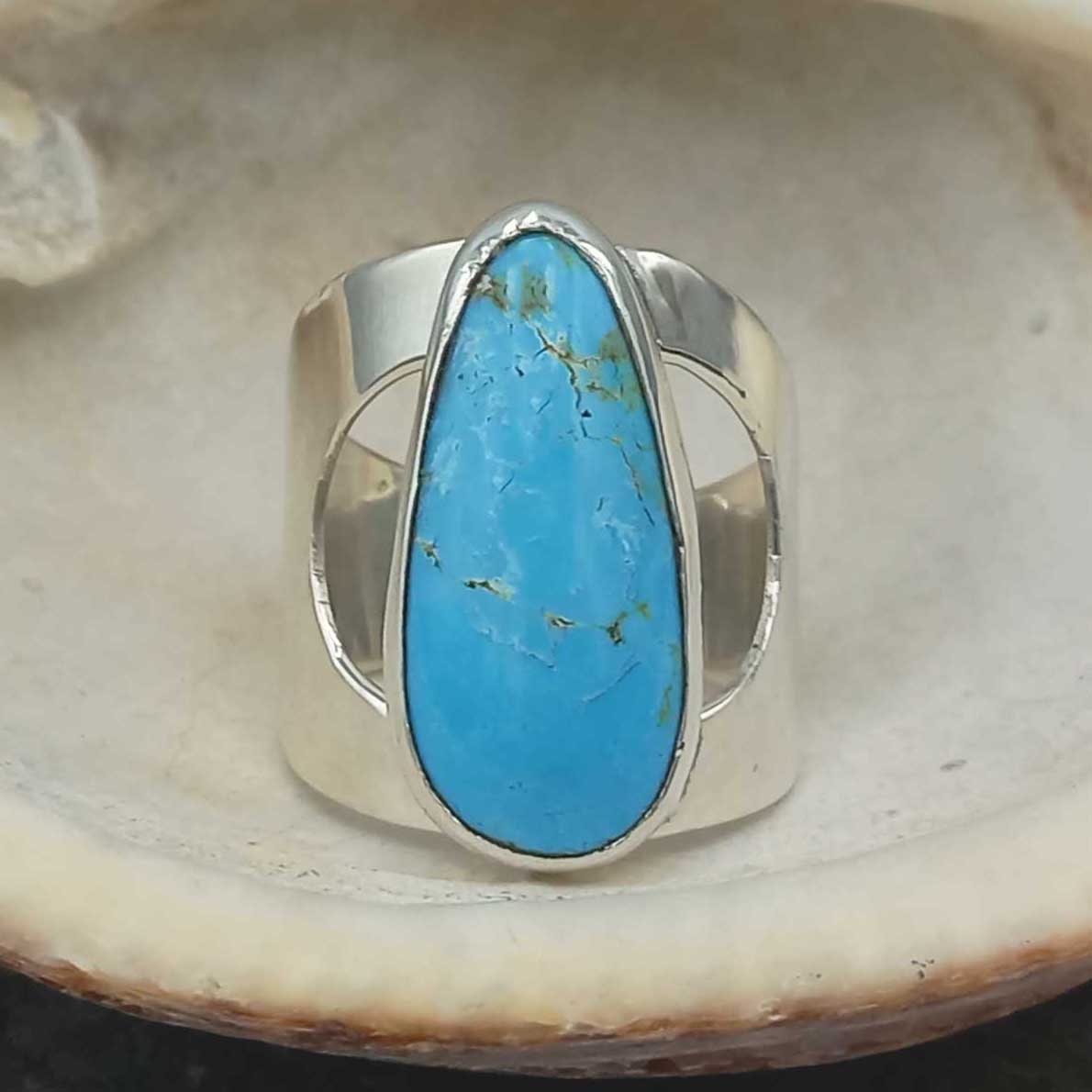 Teardrop handmade sterling silver ring with turquoise.