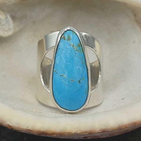 Teardrop handmade sterling silver ring with turquoise.