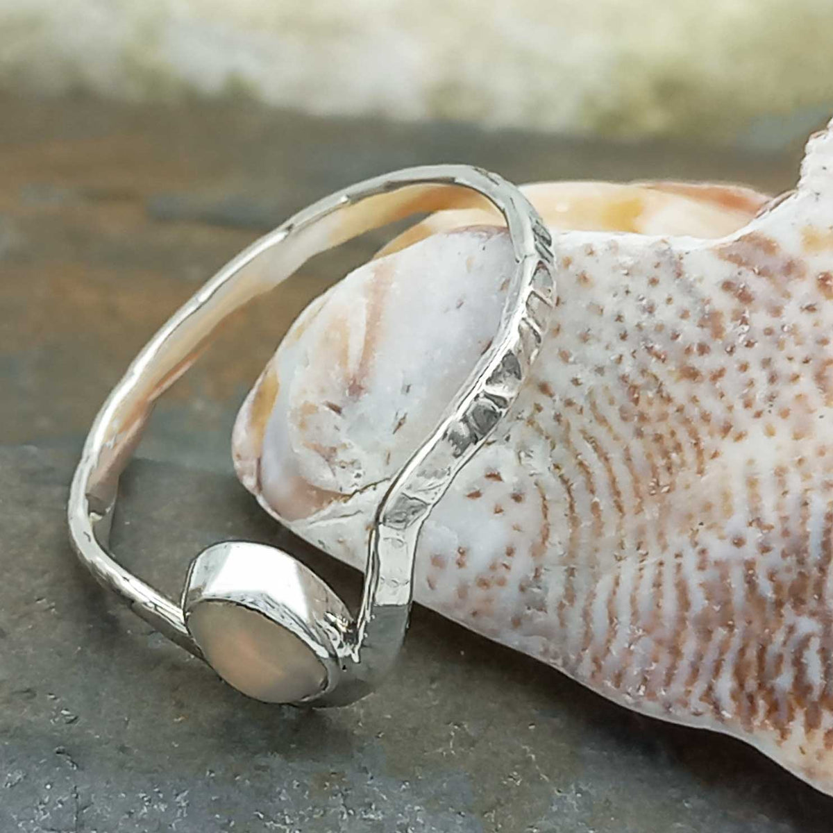 Handmade textured silver ring with opal