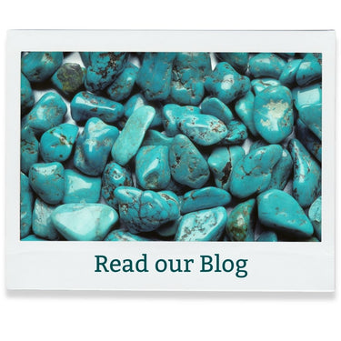 Turquoise stones with 'Read our Blog' text on a white background