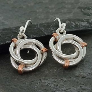 Twisting silver circles with copper detail silver earrings