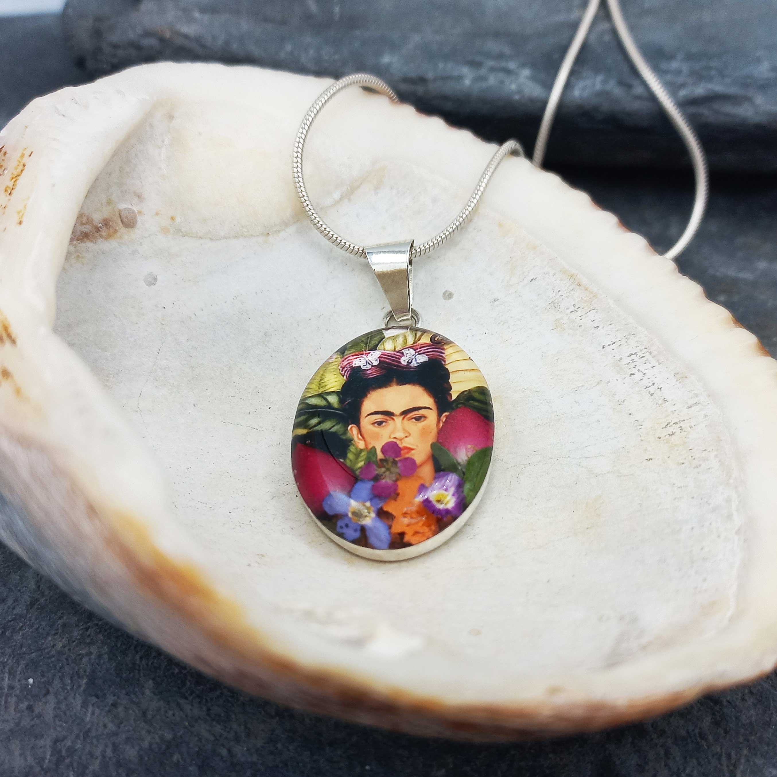 Frida Kahlo pendant on a shell.