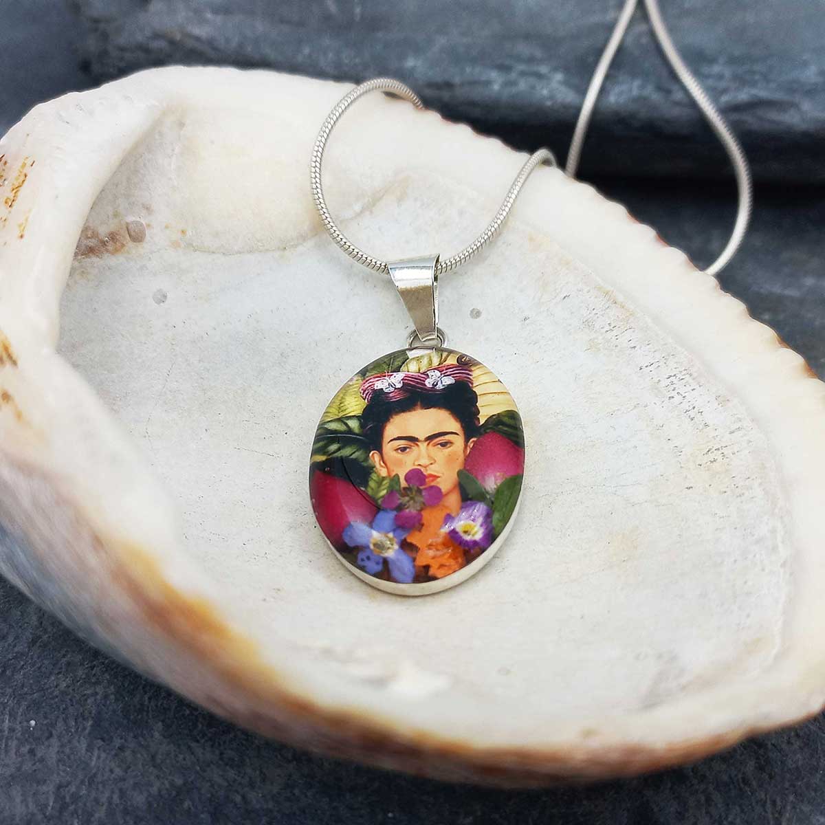 Frida Kahlo pendant on a shell.