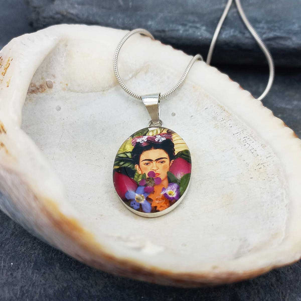 Frida Kahlo pendant on a shell.