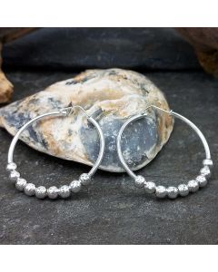 Beads on silver hoops