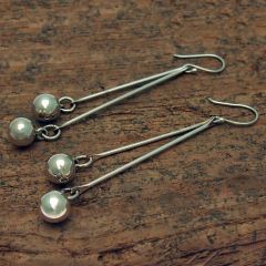 Long drop silver ball earrings